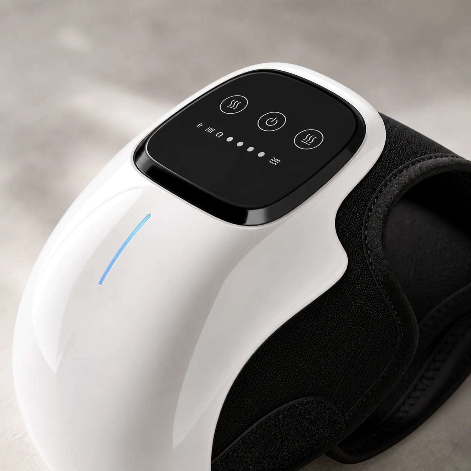 Close-up of Foxiora electric knee massager control panel and wrap material